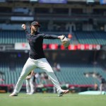 Relief pitcher throwing on outfield line